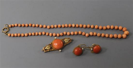 A continental yellow metal, coral and seed pearl brooch and pair of matching earrings and a coral bead necklace.